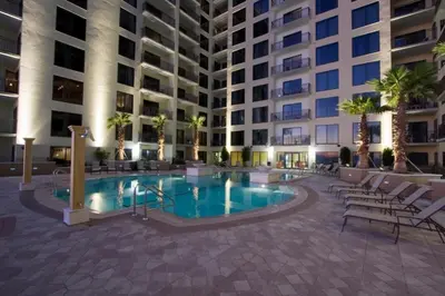 a swimming pool in front of a building at Origin 1038, Sunset & Gulf View! Perfect for 2! Free Fun! condo in Panama City Beach