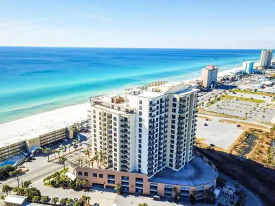 an aerial view of a building next to the beach at Origin 1038, Sunset & Gulf View! Perfect for 2! Free Fun! condo in Panama City Beach
