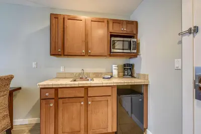 a kitchen with a sink and a microwave at Origin 1038, Sunset & Gulf View! Perfect for 2! Free Fun! condo in Panama City Beach