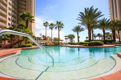 a swimming pool with a water slide in a resort at Shores of Panama 325 - 3rd Floor, Updated, Free Fun! Sleeps 6, condo in Panama City Beach