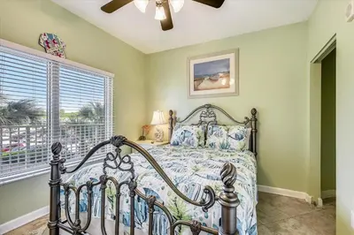 a bedroom with a bed and a window at Shores of Panama 204 - 2nd Floor 2 Bedroom Sleeps 8, Same Floor Reserved Parking, Free Fun condo in Panama City Beach