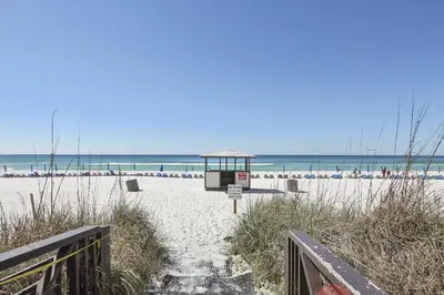 a beach with a gazebo on the sand at Shores of Panama 204 - 2nd Floor 2 Bedroom Sleeps 8, Same Floor Reserved Parking, Free Fun condo in Panama City Beach