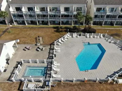 an overhead view of a swimming pool in a hotel at Endless Summer #C4 by Nautical Properties Vacation Rentals in Panama City Beach