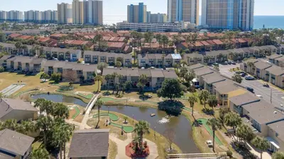an aerial view of a city with a park at Compass Cove at Gulf Highlands by Nautical Properties Vacation Rentals in Panama City Beach