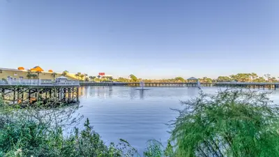 a large body of water with a pier and buildings at Laketown Wharf #101 by Nautical Properties Vacation Rentals in Panama City Beach