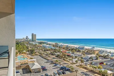an aerial view of a resort with a parking lot and the ocean at Living Right at Laketown Wharf #1016 by Nautical Properties in Panama City Beach