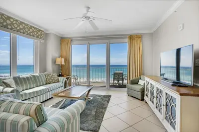 a living room with a view of the ocean at Grandview East 301 in Panama City Beach