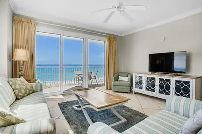 a living room with a view of the ocean at Grandview East 301 in Panama City Beach