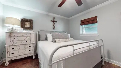 a white bedroom with a bed and a dresser at Private Pool - Steps To Beach - Fenced Backyard - FLPCB74 in Panama City Beach