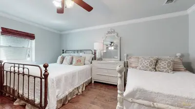 a white bedroom with two beds and a window at Private Pool - Steps To Beach - Fenced Backyard - FLPCB74 in Panama City Beach