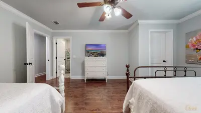 a bedroom with two beds and a ceiling fan at Private Pool - Steps To Beach - Fenced Backyard - FLPCB74 in Panama City Beach
