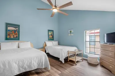 a bedroom with two beds and a ceiling fan at Horizon South 51B in Panama City Beach
