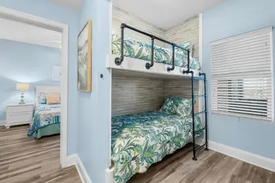 a bedroom with a bunk bed in a room at Stunning Ocean Views! Resort Beach Condo! Sleeps 8! by Dolce Vita Getaways PCB in Panama City Beach