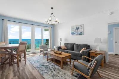 a living room with a couch and a table at Stunning Ocean Views! Resort Beach Condo! Sleeps 8! by Dolce Vita Getaways PCB in Panama City Beach