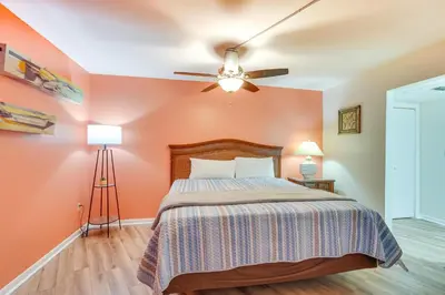 a bedroom with a bed and a ceiling fan at PCB Vacation Rental with Sweeping Ocean Views! in Panama City Beach