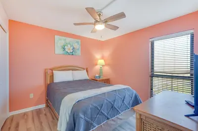 a bedroom with a bed and a ceiling fan at PCB Vacation Rental with Sweeping Ocean Views! in Panama City Beach