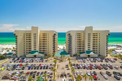 an aerial view of a parking lot at a resort at Sunbird Resort! Direct Beachfront Condo! Free Beach Chairs! by Dolce Vita Getaways PCB in Panama City Beach