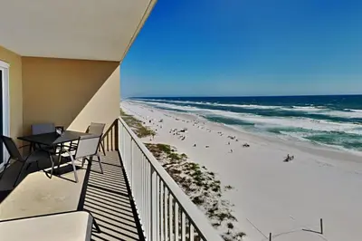 a balcony with a view of the beach at Grandview East #703 in Panama City Beach