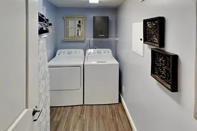 a laundry room with a washer and dryer at Grandview East #703 in Panama City Beach