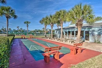 a basketball court with palm trees and a building at Pool and Beach Access Sunnyside 55 in PCB! in Panama City