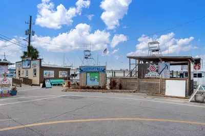 an empty parking lot next to a gas station at Beautiful Ocean Views! 2-Bedroom, 2-Bathroom! Resort Pools! in Panama City Beach