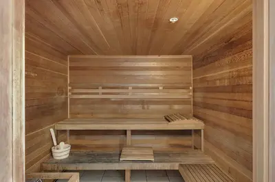 a sauna with a bench in a wooden room at Beautiful Ocean Views! 2-Bedroom, 2-Bathroom! Resort Pools! in Panama City Beach