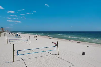 a beach with a group of volleyball nets on it at 140 Feet To White Sandy Beaches! Newly Renovated! Pool! Grill! in Panama City Beach