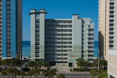 a group of tall buildings with the ocean in the background at Gulf Front Master Suite! Directly On The Beach! 3 BR / 2 BA! Sleeps 8! in Panama City Beach