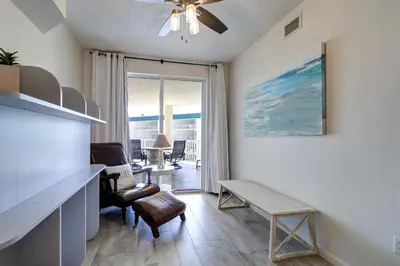 a living room with a table and a living room with a view at Stunning 2 BR/2 BA Third Floor Unit Directly On Santa Rosa Beach! Sleeps 6! in Santa Rosa Beach