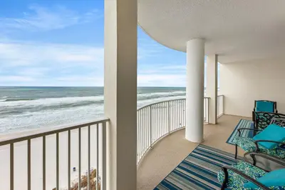 a balcony with chairs and a view of the ocean at Large Balcony! Gulf Front Master Suite! Many Amenities On-Site! in Panama City Beach