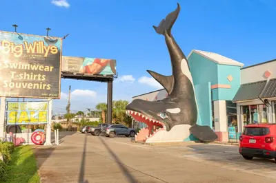 a statue of a shark on the side of a street at Large Balcony! Gulf Front Master Suite! Many Amenities On-Site! in Panama City Beach