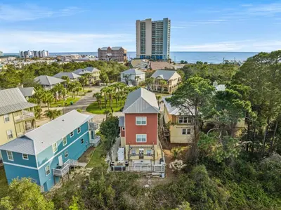 an aerial view of a neighborhood with houses at Algun Dia - Plush Family-Friendly Home - A Block from Beach in Panama City Beach
