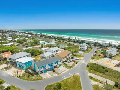 an aerial view of a coastal town with the ocean at 120 Palm Beach Dr A - La Casa Turquesa in Panama City Beach