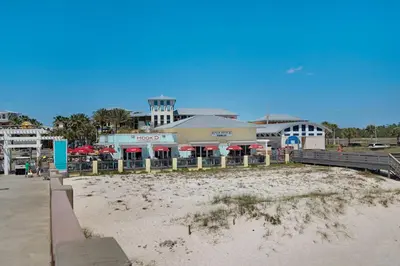 a beach with a restaurant and a building at Sleep in Comfort in The Most Spacious 2 Bedrooms Tidewater Has to Offer in Panama City Beach