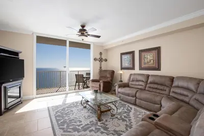 a living room with a couch and a table at Sleep in Comfort in The Most Spacious 2 Bedrooms Tidewater Has to Offer in Panama City Beach
