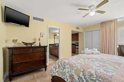 a bedroom with a bed and a flat screen tv at Beautiful Long Beach Condo unit 1-1206! TWO Gulf Masters! in Panama City Beach