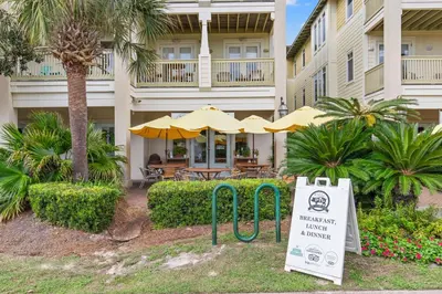 a sign in front of a building with a hotel at 24 York Lane | Edgewater Escape in Inlet Beach