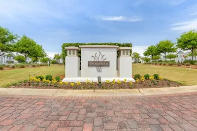 a monument in a park with flowers and trees at 24 York Lane | Edgewater Escape in Inlet Beach