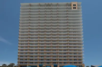 a tall building with white balconies on it at Gulf Front! 2 BR 2 BA! 11th Floor condo + Condo Amenities! in Panama City Beach
