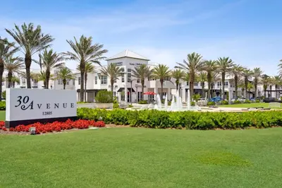 a sign in a park in front of a resort at The FUN Orange home in a Great Location with bonus GAME room in Rosemary Beach