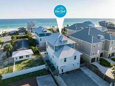 an aerial view of a house with the ocean in the background at Three Master Bedrooms! Easy Beach Access! Gulf Views in Panama City Beach