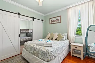 a bedroom with a bed with towels on it at 109 Island Cove Ct - Blue Palm Cove in Panama City Beach