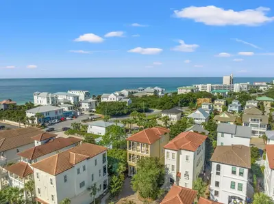 an aerial view of a city with houses and the ocean at Feel Like Luxury Vacationing in this Private Community in Seagrove on 30A in Santa Rosa Beach