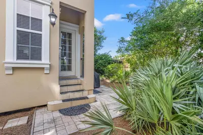 a front door of a house with plants at Feel Like Luxury Vacationing in this Private Community in Seagrove on 30A in Santa Rosa Beach