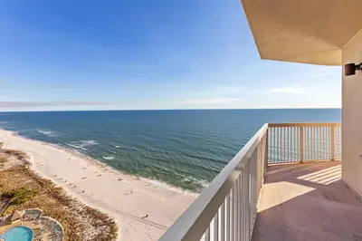 a balcony with a view of the beach at Gulf Front Master Bedroom, 2 Pools & Hot Tubs, Sleeps 8 in Panama City Beach