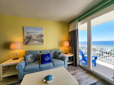 a living room with a couch and a view of the ocean at Laketown Wharf 911 - Luxury at the Wharf in Panama City Beach