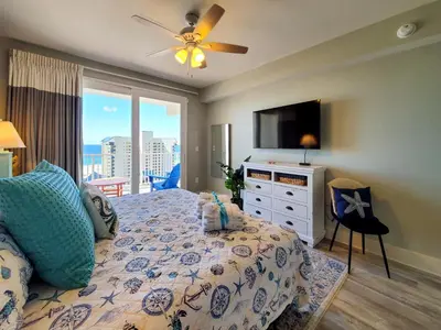 a bedroom with a bed with a flat screen tv at Laketown Wharf 911 - Luxury at the Wharf in Panama City Beach