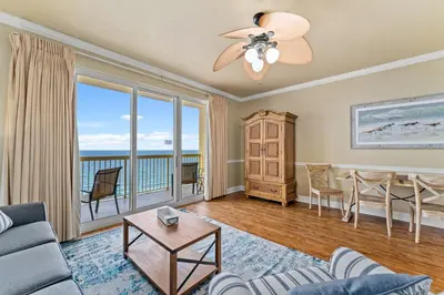 a living room with a view of the ocean at Right Across The Street From Pier Park! 2 Pools Overlooking Gulf!Next To Pier in Panama City Beach