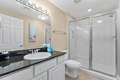 a bathroom with a shower and a sink and a toilet at Right Across The Street From Pier Park! 2 Pools Overlooking Gulf!Next To Pier in Panama City Beach
