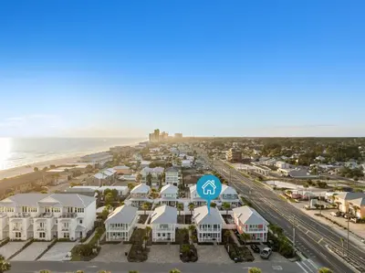 an aerial view of a resort with the beach at Fabulous Modern Beach House - 4BR, 35BA: POOL/Beach View & Access/Balcony in Panama City Beach
